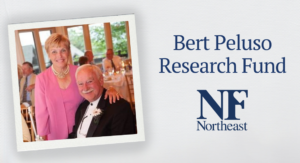 polaroid image of Bert Peluso in a suit with his wife Karen Peluso in a pink dress at a formal event; text next to the image reads "Bert Peluso Research Fund" with the NF Northeast logo below